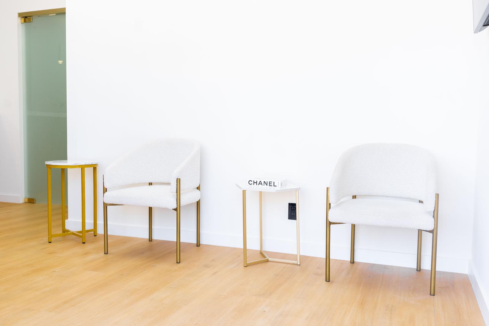 White and gold chairs in the Royalty Dental waiting area